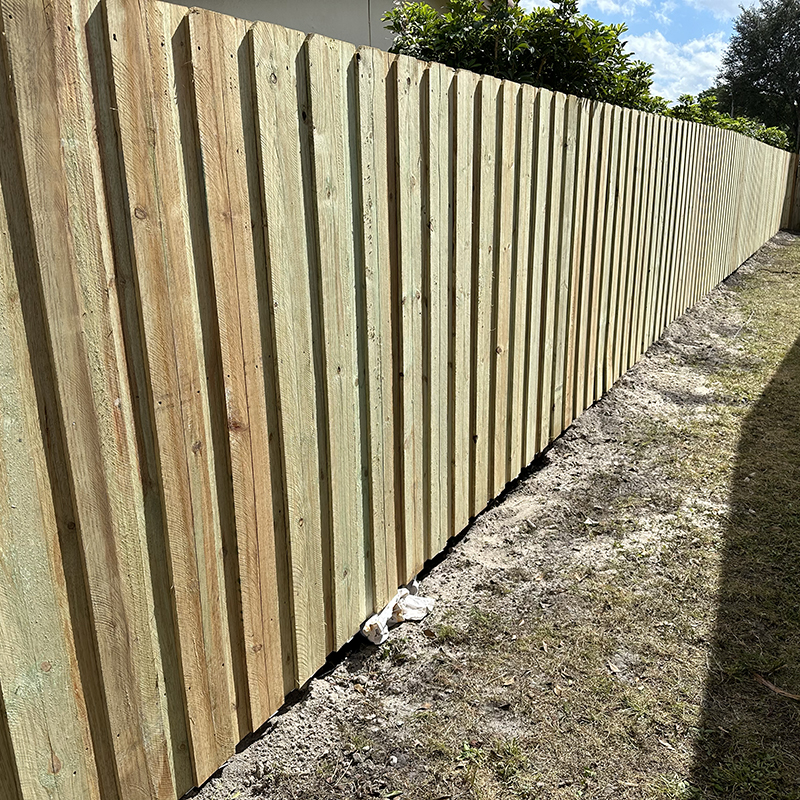 Board on Board Wood Fence in Plantation